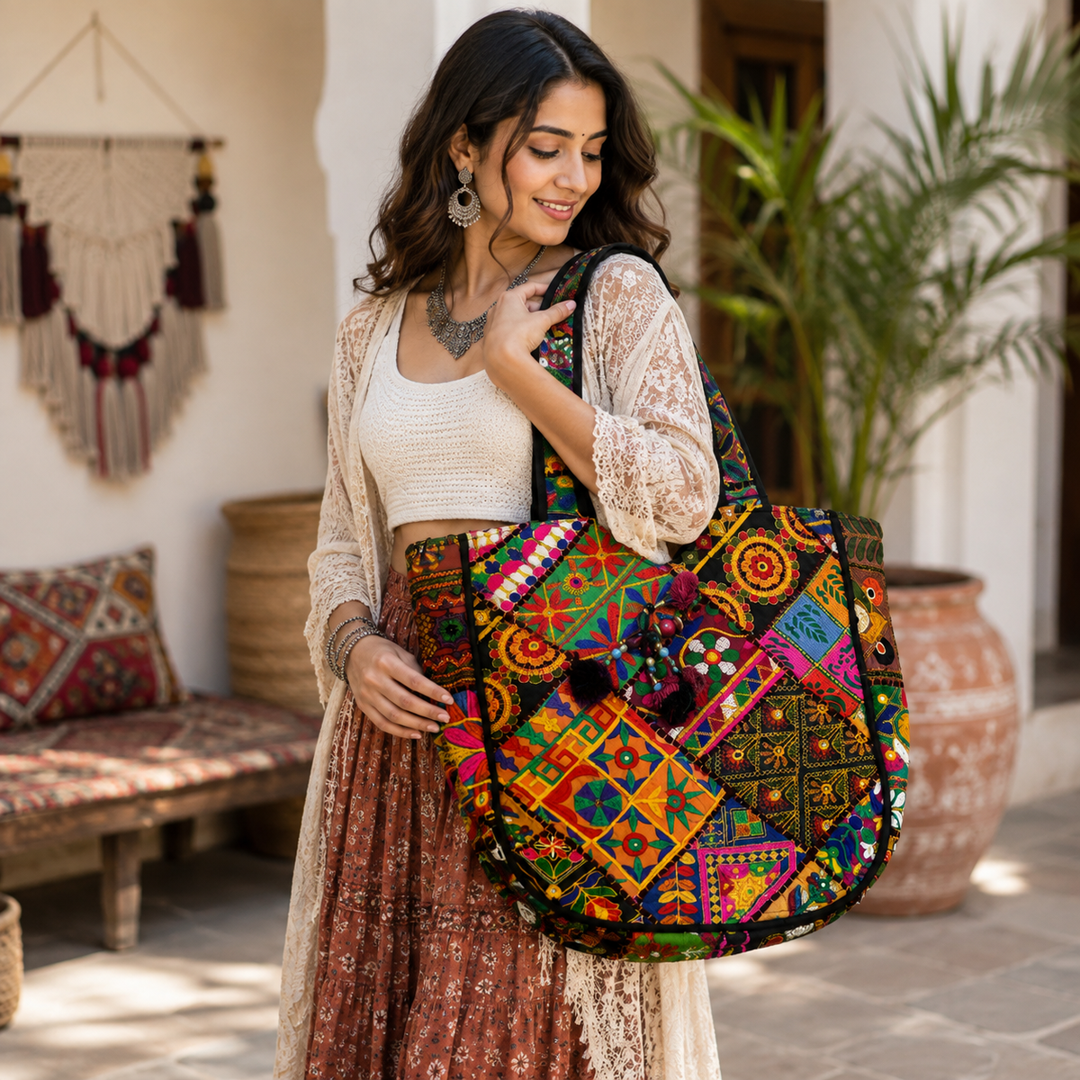Woman with an embroidered white colorful boho slingbag in a chic kurti and jeans attire