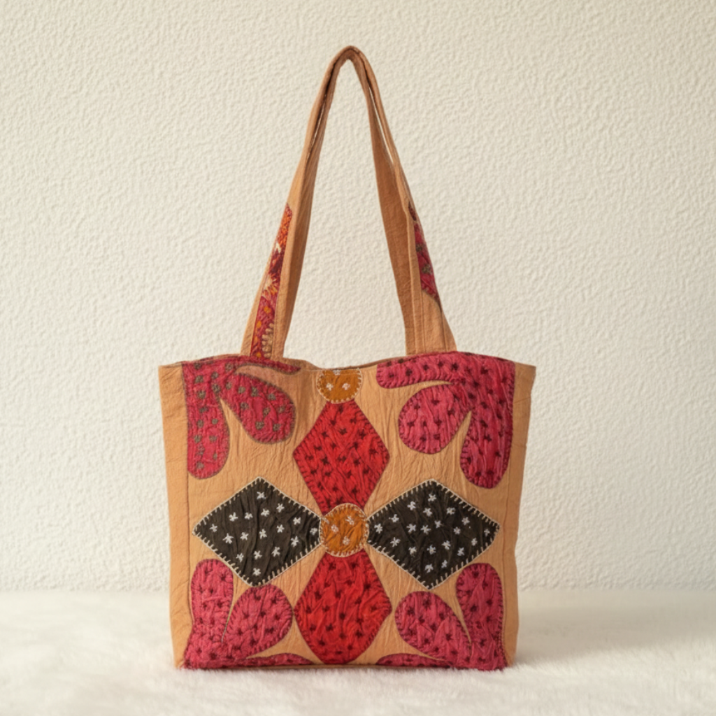 applique Tote bag with floral pattern on a plain background