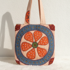 Tote bag with floral design on a white background