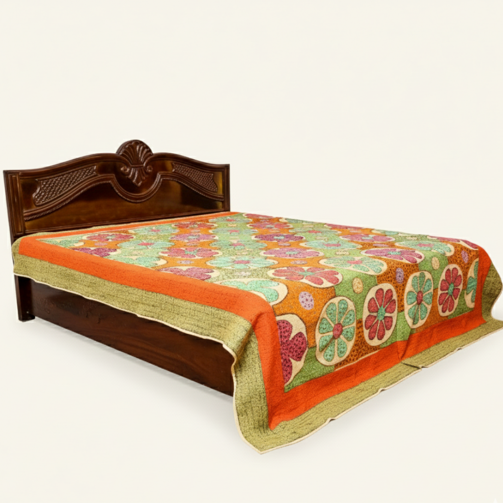 Decorative applique bedspread with floral pattern on a wooden bed